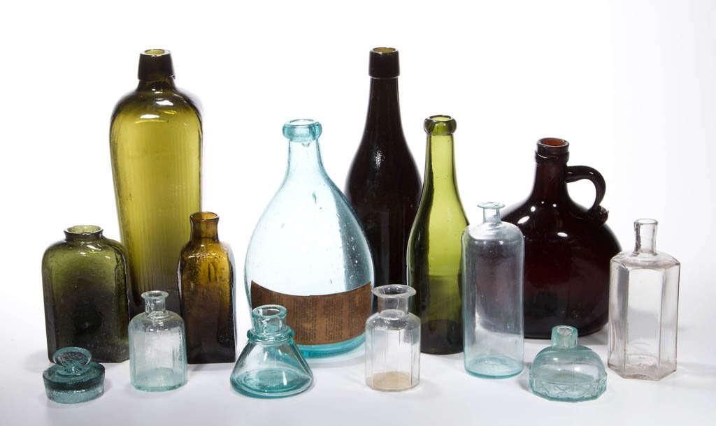 ASSORTED UTILITY BOTTLES, LOT OF 13: ASSORTED UTILITY BOTTLES, LOT OF 13, aquamarine, olive green, yellow amber, and red amber, including a beehive-form example, two inks, and several paneled examples, five with rough pontil marks. Toget