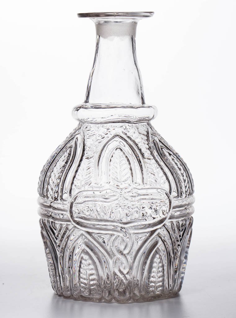 BLOWN-MOLDED GIV-7 "WINE" PINT DECANTER: BLOWN-MOLDED GIV-7 "WINE" PINT DECANTER, colorless, molded neck ring, Rayed and Ringed type II base with rough pontil mark, lacking stopper. Boston & Sandwich Glass Co. Circa 1825-1835. 8 1/2" H. Lite