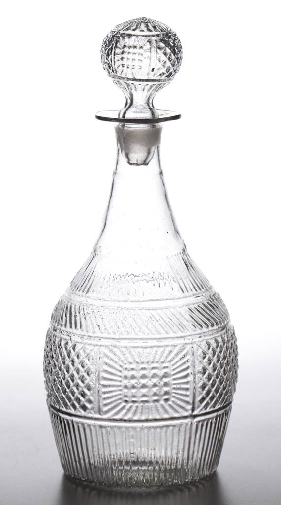 BLOWN-MOLDED GIII-19 QUART DECANTER: BLOWN-MOLDED GIII-19 QUART DECANTER, colorless, molded neck ring, Rayed type VI.A base with rough pontil mark, with appropriate type 7 stopper. Boston & Sandwich Glass Co. Circa 1825-1835. 10 1/4" HOA