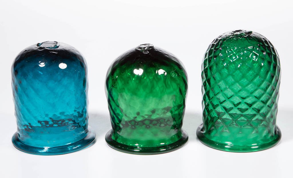 ASSORTED PATTERN-MOLDED CHRISTMAS LIGHTS, LOT OF THREE: ASSORTED PATTERN-MOLDED CHRISTMAS LIGHTS, LOT OF THREE, two emerald green and one teal, each diamond molded with folded rim and rough pontil mark. 19th century. 3" to 3 1/2" H. Provenance: From a New 