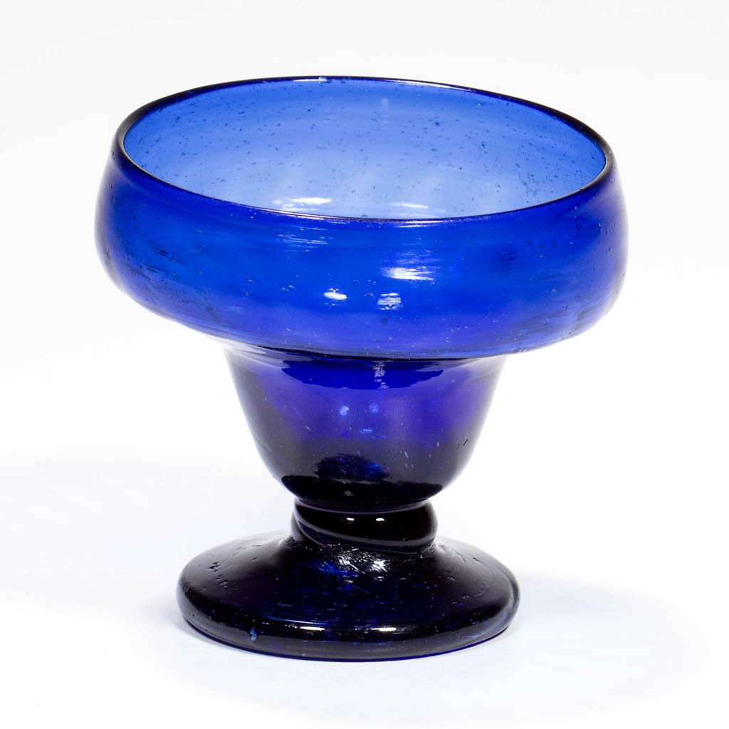 PATTERN-MOLDED RIB FOOTED OPEN SALT: PATTERN-MOLDED RIB FOOTED OPEN SALT, cobalt blue, double-ogee bowl patterned with vertical ribs, raised on a short thick stem and an applied circular sloping foot with rough iron pontil mark. Possibly