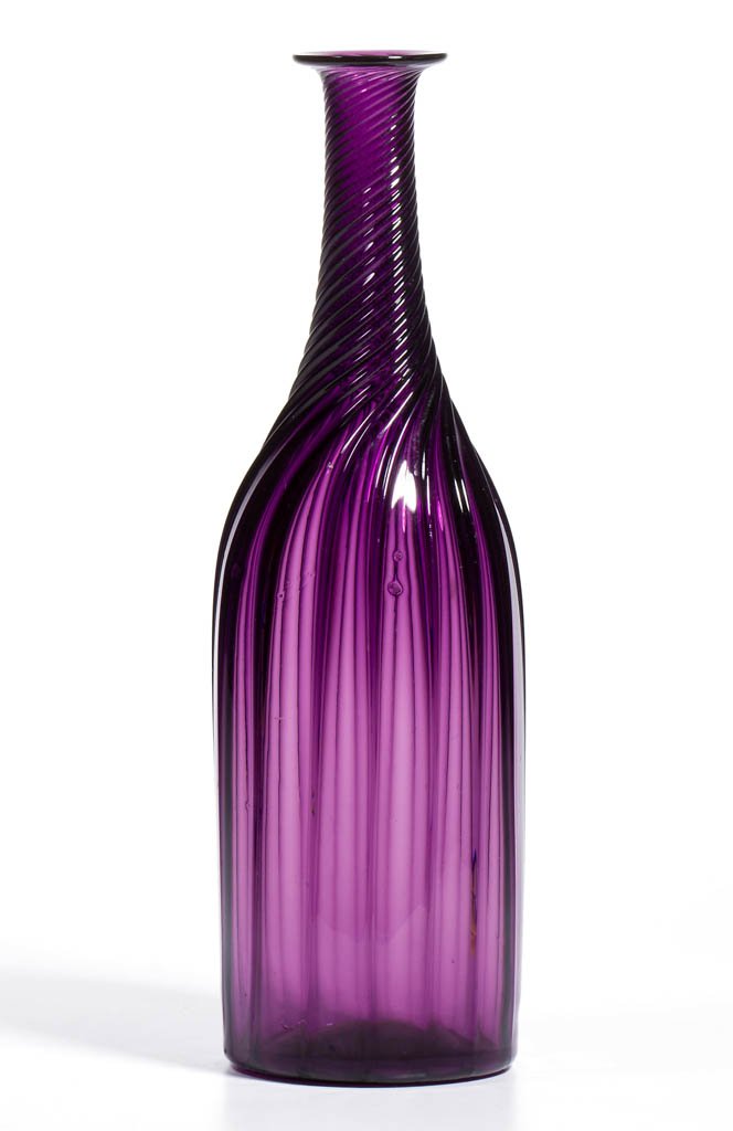 SWIRLED PILLAR-MOLDED DECANTER: SWIRLED PILLAR-MOLDED DECANTER, deep brilliant amethyst, cylinder form with 16 ribs swirled to the right on the tapered neck, with plain, flared mouth, and polished pontil mark. Neck not ground for st