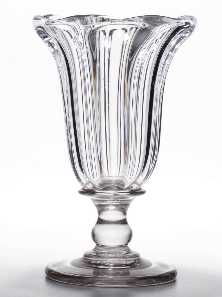 PILLAR-MOLDED DIMINUTIVE VASE OR CELERY GLASS: PILLAR-MOLDED DIMINUTIVE VASE OR CELERY GLASS, colorless with grayish tint, heavy deep bowl with eight pronounced ribs and lightly scalloped rim, raised on an applied broad-top baluster-form stem and 