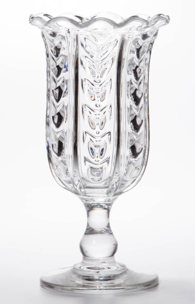 DRAPE AND PILLAR-MOLDED VASE OR CELERY GLASS: DRAPE AND PILLAR-MOLDED VASE OR CELERY GLASS, colorless, deep bowl with six alternating drape panels and ribs with a gauffered rim, raised on a solid baluster-form stem and circular foot with a polish