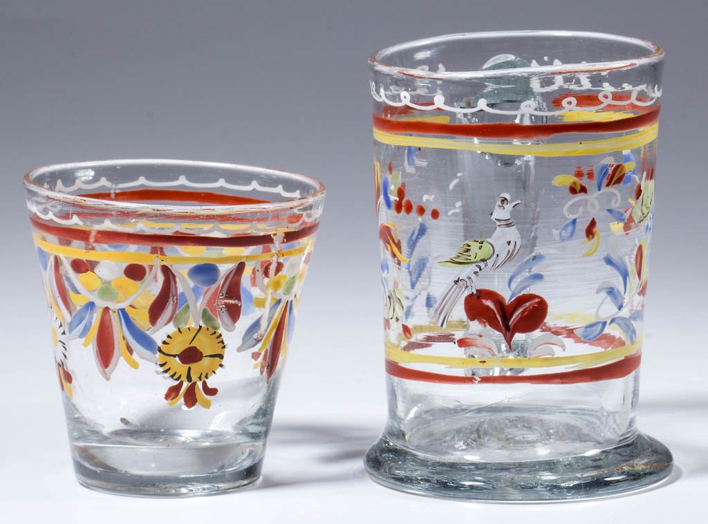 FREE-BLOWN AND DECORATED "STIEGEL-TYPE" DIMINUTIVE: FREE-BLOWN AND DECORATED "STIEGEL-TYPE" DIMINUTIVE DRINKING VESSELS, LOT OF TWO, colorless, each with polychrome-enamel decoration, comprising a tankard mug with applied strap handle and featuring a d