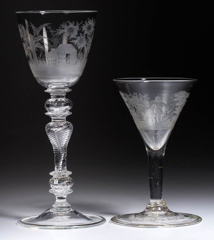 FREE-BLOWN AND ENGRAVED DRINKING VESSELS, LOT OF TWO: FREE-BLOWN AND ENGRAVED DRINKING VESSELS, LOT OF TWO, colorless, comprising a chalice with fancy multi-part stem, the bowl featuring a landscape including a structure and copulating fowl, and a trumpe