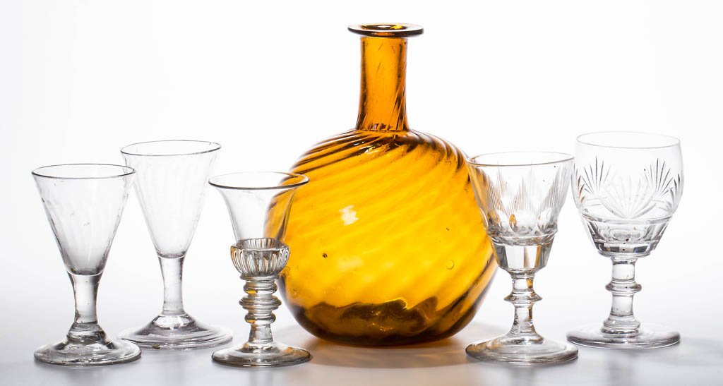 ASSORTED BLOWN, MOLDED, AND CUT WINE GLASSES, LOT OF: ASSORTED BLOWN, MOLDED, AND CUT WINE GLASSES, LOT OF FIVE, colorless, comprising an example with gadrooning at base of bowl, two with light pattern-molded ribs, and two with cut decorations; polished 