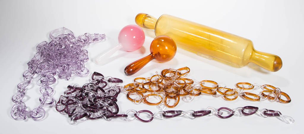 ASSORTED WHIMSY ARTICLES, LOT OF SIX: ASSORTED WHIMSY ARTICLES, LOT OF SIX, colorless with amber and aqua, comprising two darners, a rolling pin, and three chains. 20th century. 5 1/2" to 60" L.Provenance: From a Pennsylvania private coll
