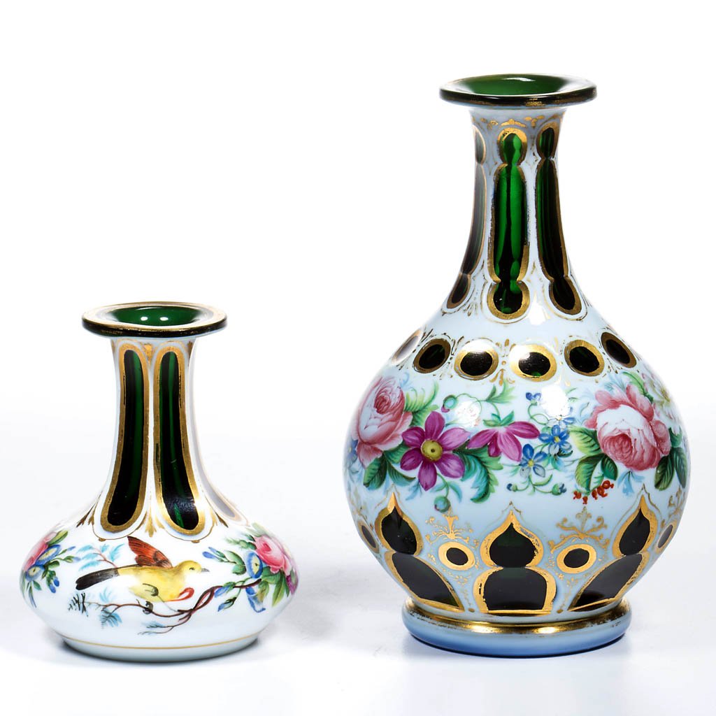 EUROPEAN DECORATED CUT OVERLAY COLOGNE BOTTLES, LOT OF: EUROPEAN DECORATED CUT OVERLAY COLOGNE BOTTLES, LOT OF TWO, white to deep emerald green with gilding, each with finely executed polychrome-enamel floral decoration full round, small example with two b