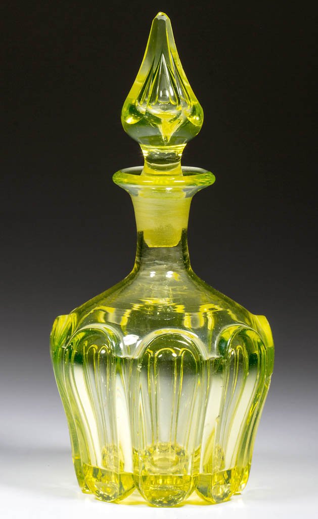 PRESSED LOOP / LEAF COLOGNE BOTTLE: PRESSED LOOP / LEAF COLOGNE BOTTLE, bright canary yellow (uranium), bowl-form with eight loops and plain shoulder, polished pontil mark, original panel-cut teared stopper, neither unit numbered. Bosto