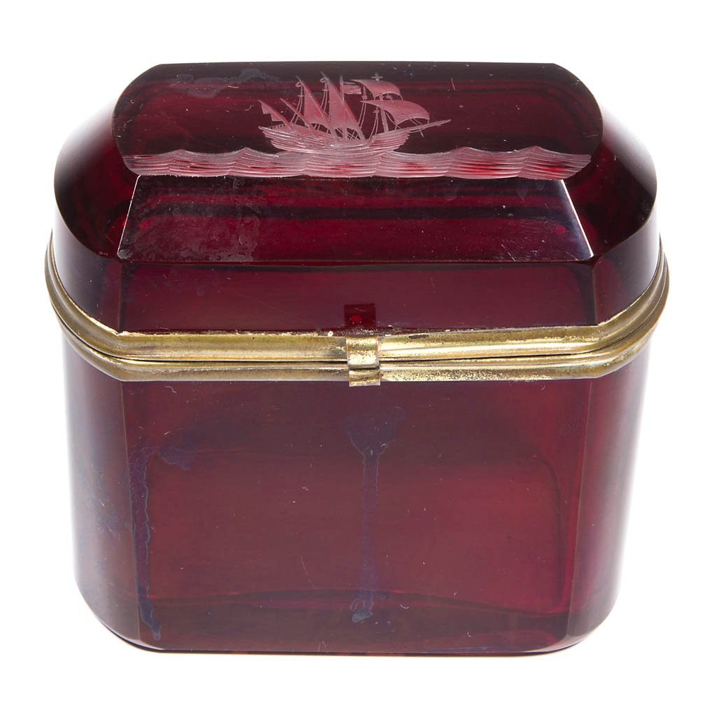 BOHEMIAN RUBY-STAINED JEWEL BOX: BOHEMIAN RUBY-STAINED JEWEL BOX, tall, casket-form with sailing ship engraved on top and gilt-metal mounts, polished base. Second half 19th century. 4" H, 4 1/4" x 2 3/8". Provenance: Property of Art 