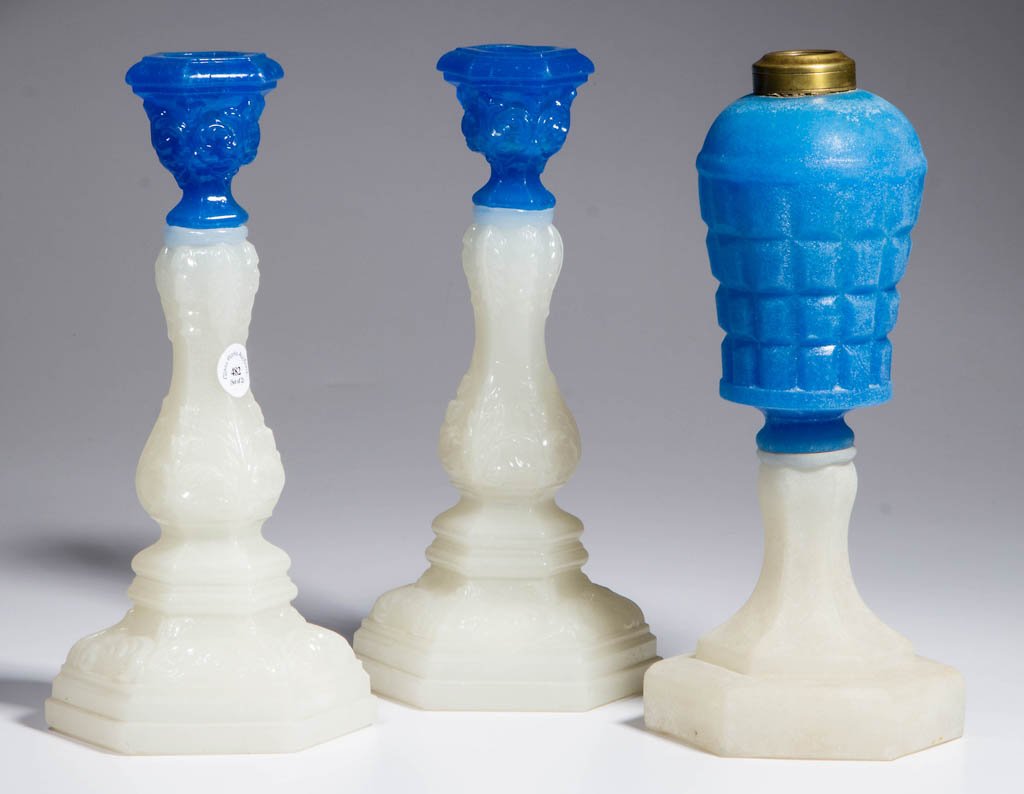 ASSORTED PRESSED LIGHTING DEVICES, LOT OF THREE: ASSORTED PRESSED LIGHTING DEVICES, LOT OF THREE, starch blue and alabaster/clambroth, comprising a pair of Acanthus Leaf candlesticks with very lightly sanded surface, and a Waffle stand lamp with hea