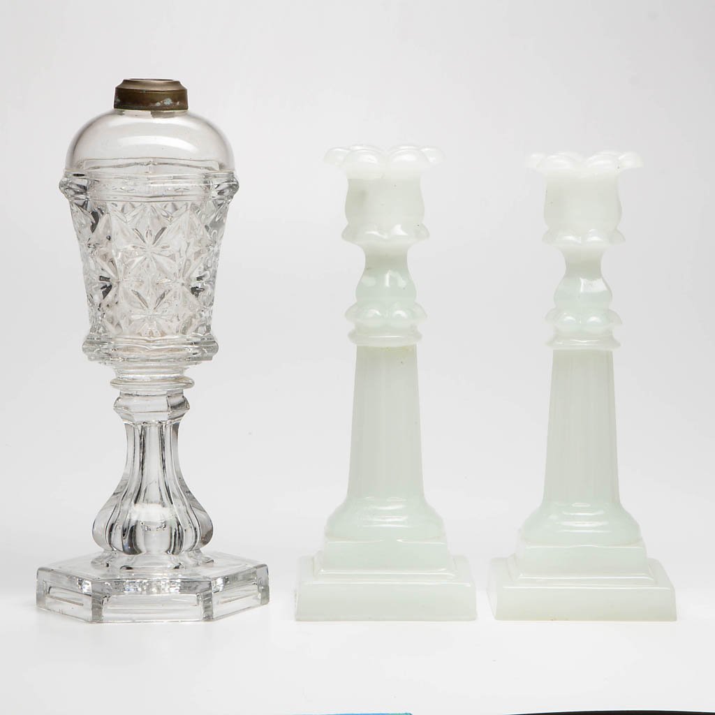 ASSORTED PRESSED LIGHTING DEVICES, LOT OF THREE: ASSORTED PRESSED LIGHTING DEVICES, LOT OF THREE, comprising a colorless Sandwich Star stand lamp, and a pair of alabaster/clambroth Petal and Columnar candlesticks, wafer construction. Boston & Sandwi
