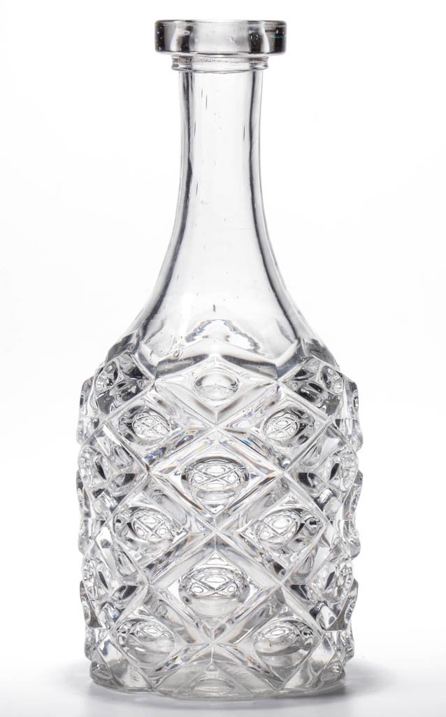 DIAMOND THUMBPRINT BAR DECANTER: DIAMOND THUMBPRINT BAR BOTTLE, colorless lead glass, applied bar lip, polished pontil mark. Boston & Sandwich Glass Co. and others. Circa 1850-1870. 10 1/8" H, 4 1/4" DOA base. Literature: Parallels B