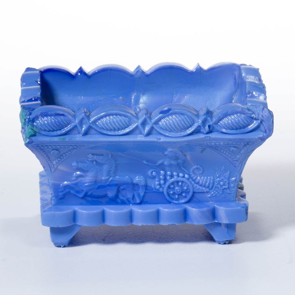 CT-1 CHARIOT PRESSED OPEN SALT: CT-1 CHARIOT PRESSED OPEN SALT, silvery opaque blue with mottling, scallop and point rim. Very rare. Boston & Sandwich Glass Co. Circa 1835-1850. 1 3/4" H, 2 1/8" x 2 7/8".Literature: Neal, p. 35. Par