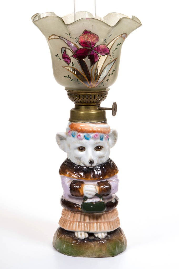VERY RARE LADY FOX FIGURAL MINIATURE OIL LAMP: VERY RARE LADY FOX FIGURAL MINIATURE OIL LAMP, porcelain and colorless glass, base has fired decoration in lavender, peach, brown, pink, blue, tan and amber glass eyes, underside with impressed blue R