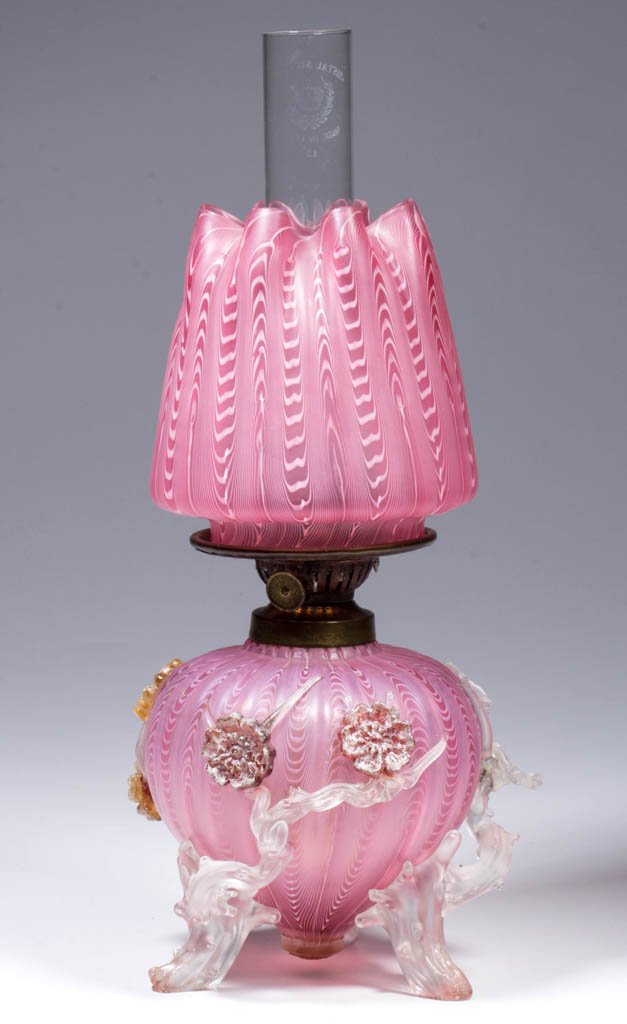 VERY RARE VERRE MOIRE / NAILSEA ART GLASS MINIATURE OIL: VERY RARE VERRE MOIRE / NAILSEA ART GLASS MINIATURE OIL LAMP, cranberry and white satin, very ornate apple shape font, rib pattern, frosted applied thorn feet and floral decoration, matching pattern c