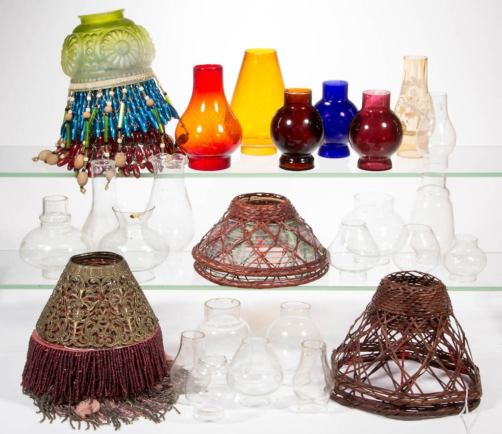 ASSORTED PATTERN AND SIZE CHIMNEYS AND SHADES, LOT OF: ASSORTED PATTERN AND SIZE CHIMNEYS AND SHADES, LOT OF 38, colorless, amber with Mary Gregory-type decoration, green satin, including nine metal cut-out with original lining and glass bead fringe, four