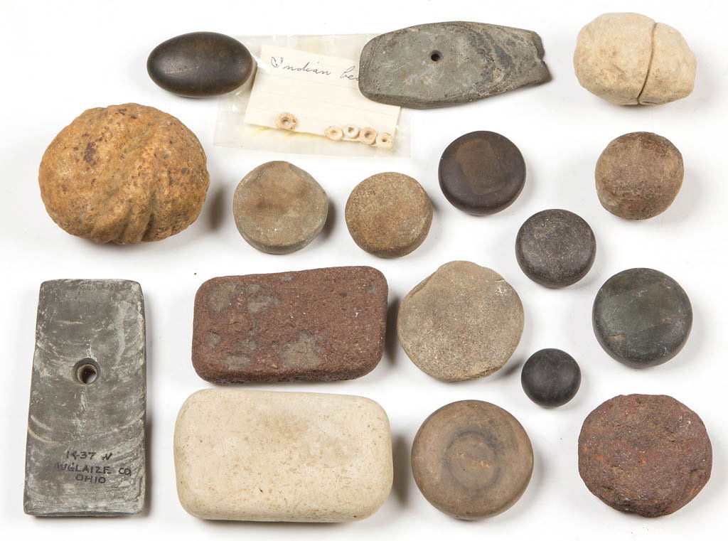 NATIVE AMERICAN STONE ARTICLES, LOT OF 17: NATIVE AMERICAN STONE ARTICLES, LOT OF 17, including grooved loafstones, slate pendants or gorgets, discoidals and game stones. One pendant marked "14-37 W / AUGLAIZE CO. / OHIO" to one face. Together