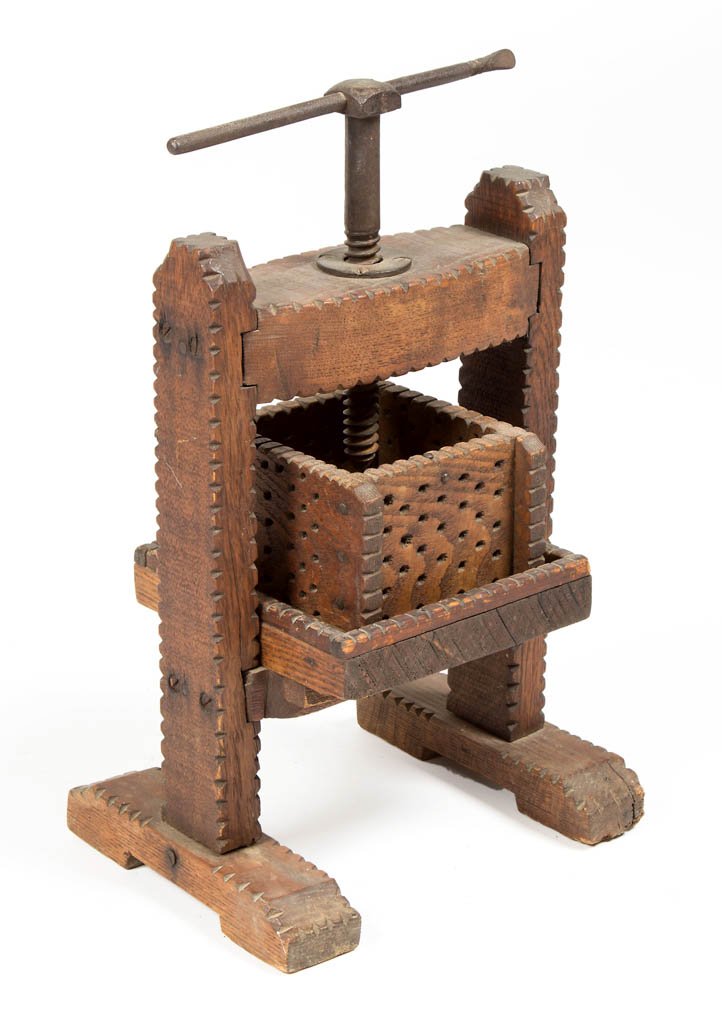 AMERICAN CARVED OAK TRAMP ART CIDER PRESS MODEL: AMERICAN CARVED OAK TRAMP ART CIDER PRESS MODEL, frame, box, and bed with chip-carved edges, center iron screw and drain spout, posts mortised through the shoe-style feet. Old dry varnished surface. S