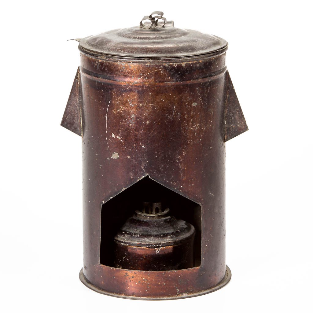 SHEET-IRON NURSE / NURSERY WHALE OIL LAMP: SHEET-IRON NURSE / NURSERY WHALE OIL LAMP, cylinder-form with strap handle and cover in an asphaltum varnish finish, interior fitted with a boiler with tab support to rim, double hooded vent holes, bo
