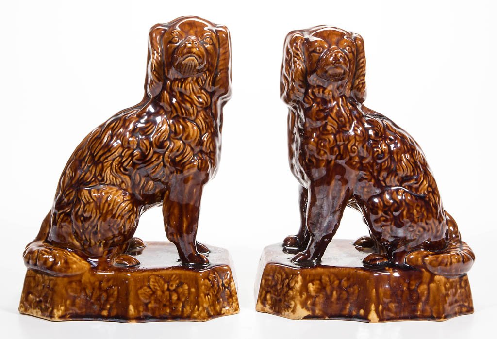 AMERICAN ROCKINGHAM-GLAZED YELLOWWARE PAIR OF SEATED (1 of 3)