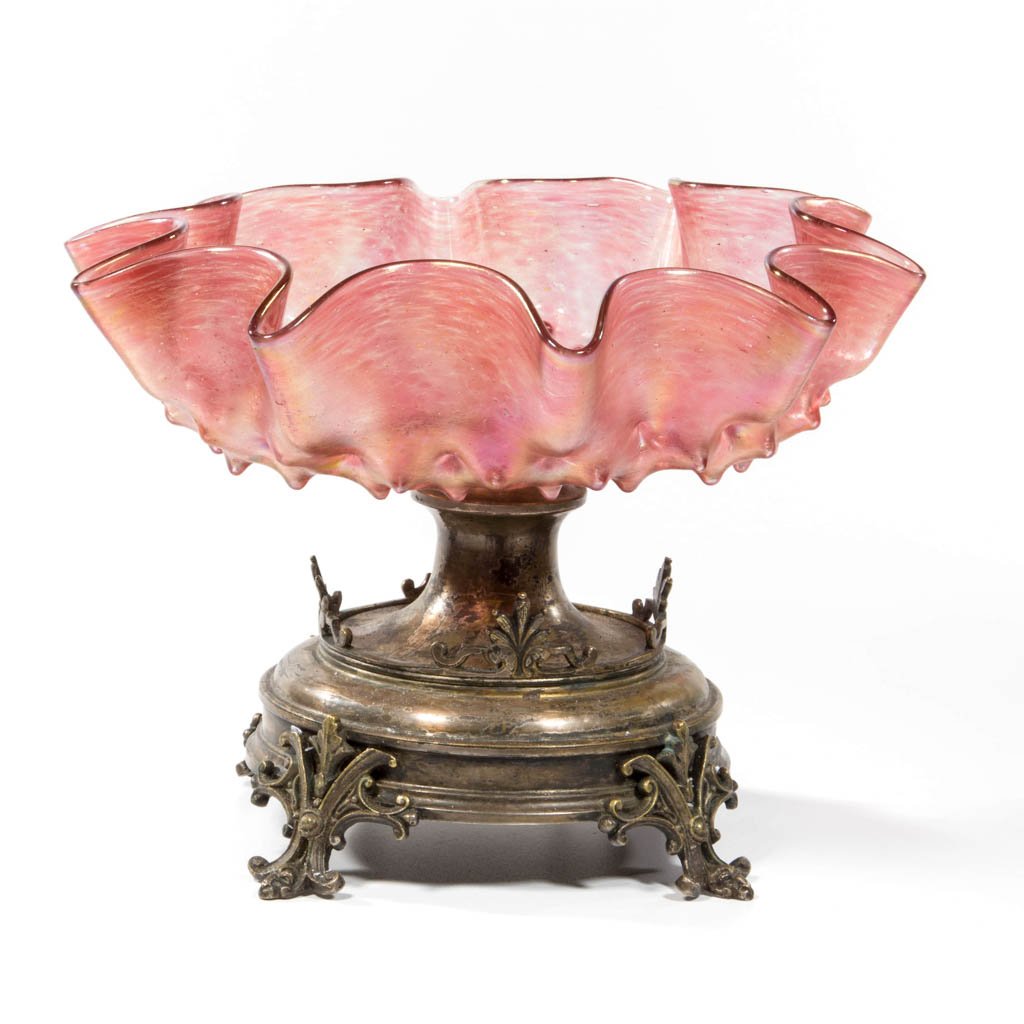LOETZ-TYPE BOHEMIAN ART GLASS BRIDE'S / CENTERPIECE: LOETZ-TYPE BOHEMIAN ART GLASS BRIDE'S / CENTERPIECE BOWL, mottled rose iridescent with scattered yellow flecks, shallow rib-optic and hobnail ruffled-rim form raised on a silver-plated standard with a