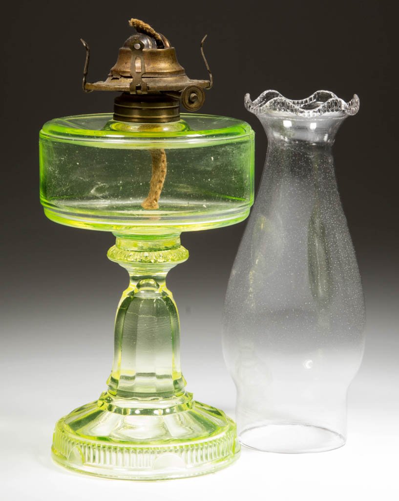 LOGAN KEROSENE STAND LAMP: LOGAN KEROSENE STAND LAMP, canary/Vaseline (uranium), No. 1 Taplin-Brown collar. Fitted with a period No. 1 slip burner and serrated-scallop top chimney. Fourth quarter 19th century. 7 1/2" H to top o