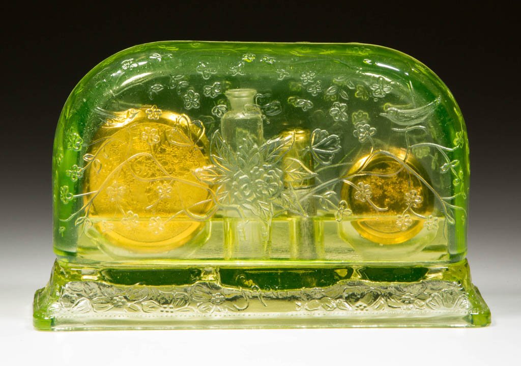 MCKEE PRESSED GLASS SHARI PERFUME DRESSER SET: MCKEE PRESSED GLASS SHARI PERFUME DRESSER SET, Vaseline (uranium), domed cover fits over rectangular base with four compartments for perfume and cosmetics, fitted with three metal compacts/lipstick ca
