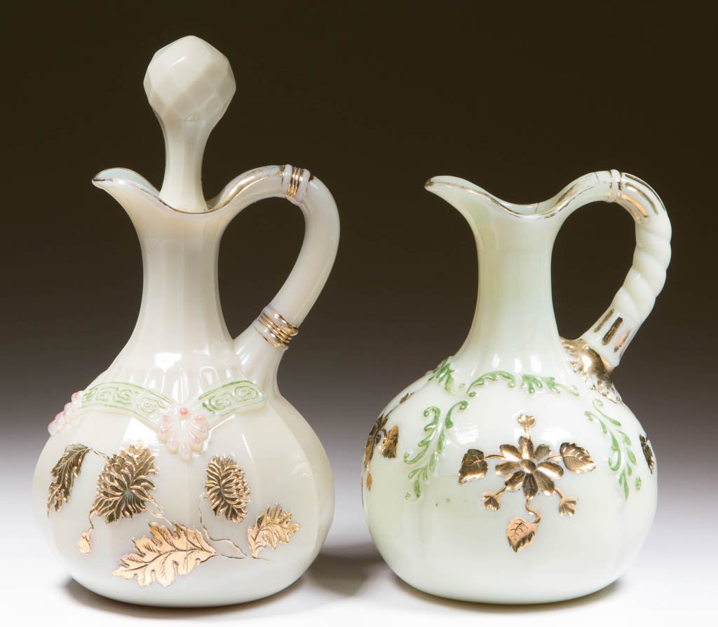 ASSORTED NORTHWOOD CUSTARD CRUETS, LOT OF TWO: ASSORTED NORTHWOOD CUSTARD CRUETS, LOT OF TWO, custard (uranium) with stained and gilt decorations, comprising Chrysanthemum Sprig/Pagoda (OMN) and Intaglio examples, one with custard (uranium) presse