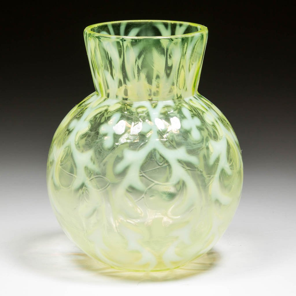 OPALINE BROCADE / SPANISH LACE VASE: OPALINE BROCADE / SPANISH LACE VASE, Vaseline (uranium) opalescent, with light melon-form body with a vine flowing to the left and slightly flared rim. Northwood Glass Co. Circa 1899. 4 1/4" H.Literat