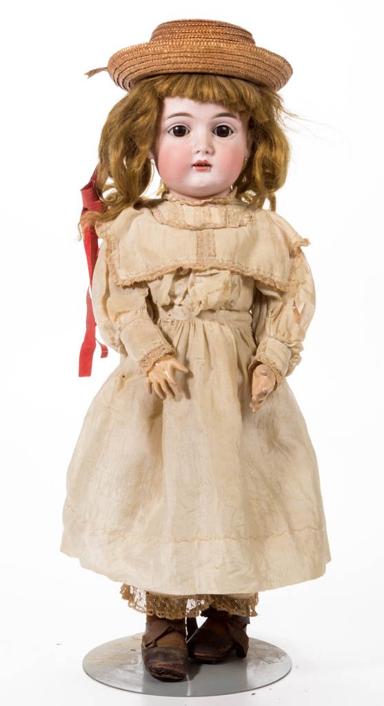 J. D. KESTNER GERMAN BISQUE-HEAD CHILD DOLL: J. D. KESTNER GERMAN BISQUE-HEAD CHILD DOLL, socket head, back incised "made in / j Germany 13", brown sleep eyes, painted eyebrows and eyelashes, reddish/brown hair, open mouth with upper teeth, ball