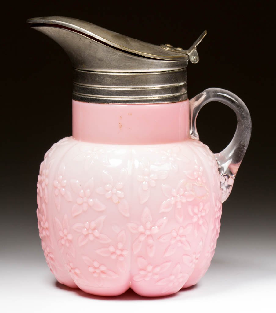CHALLINOR FORGET-ME-NOT SYRUP PITCHER: CHALLINOR FORGET-ME-NOT SYRUP PITCHER, opaque pale to dark pink, period lid. Challinor, Taylor & Co. Pattern introduced 1885. 5 1/2" HOA.Provenance: From the collection of Maxine and the late Carlton