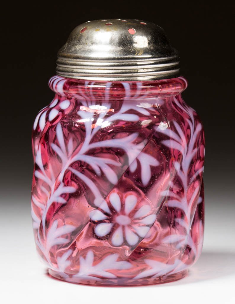 DAISY AND FERN - PARIAN SWIRL SUGAR SHAKER: DAISY AND FERN - PARIAN SWIRL SUGAR SHAKER, cranberry opalescent, period lid. Northwood Glass Co. Circa 1894. 4 3/8" H. Provenance: From the collection of Maxine and the late Carlton Rinaca of Shenand