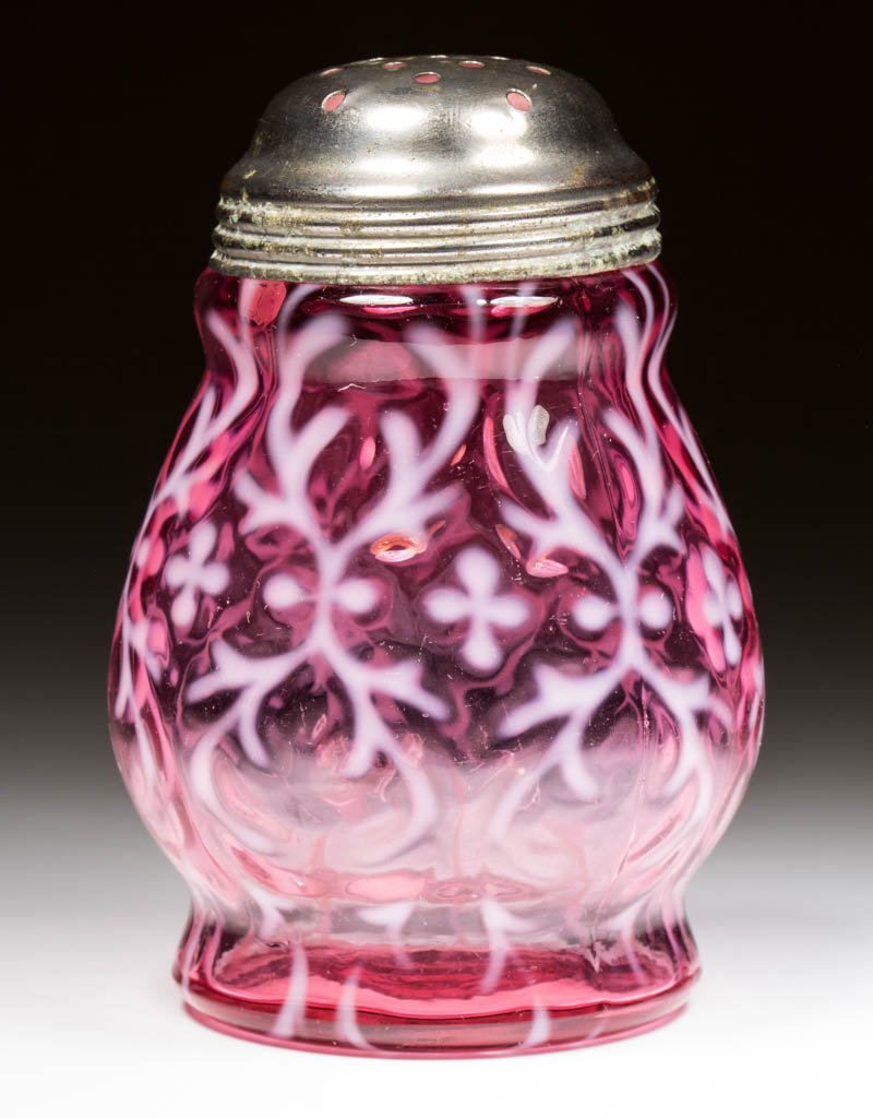 OPALINE BROCADE / SPANISH LACE SUGAR SHAKER: OPALINE BROCADE / SPANISH LACE SUGAR SHAKER, cranberry opalescent, period lid. Northwood Glass Co. Circa 1899. 4 5/8" H.Literature: Parallels Heacock/Elmore - Opalescent Glass From A to Z, p. 160, fig