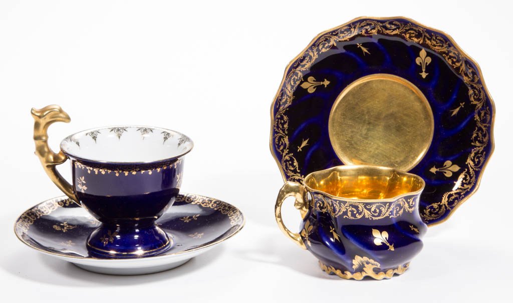 CONTINENTAL PORCELAIN CUPS AND SAUCERS, LOT OF FOUR: CONTINENTAL PORCELAIN CUPS AND SAUCERS, LOT OF FOUR, cobalt and gilt-painted decoration, comprising a finely decorated set signed "G. Asch / Tours" for Frederic Gustav Asch; and a Royal Vienna cup and