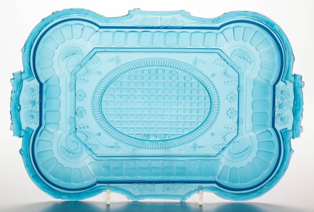 DAISY AND TREE LIMB TRAY: DAISY AND TREE LIMB TRAY, translucent starch blue, oblong form with a very detailed pattern featuring a border of tree limbs enclosing foliate and geometric motifs. Possibly Atterbury & Co. Fourth qua
