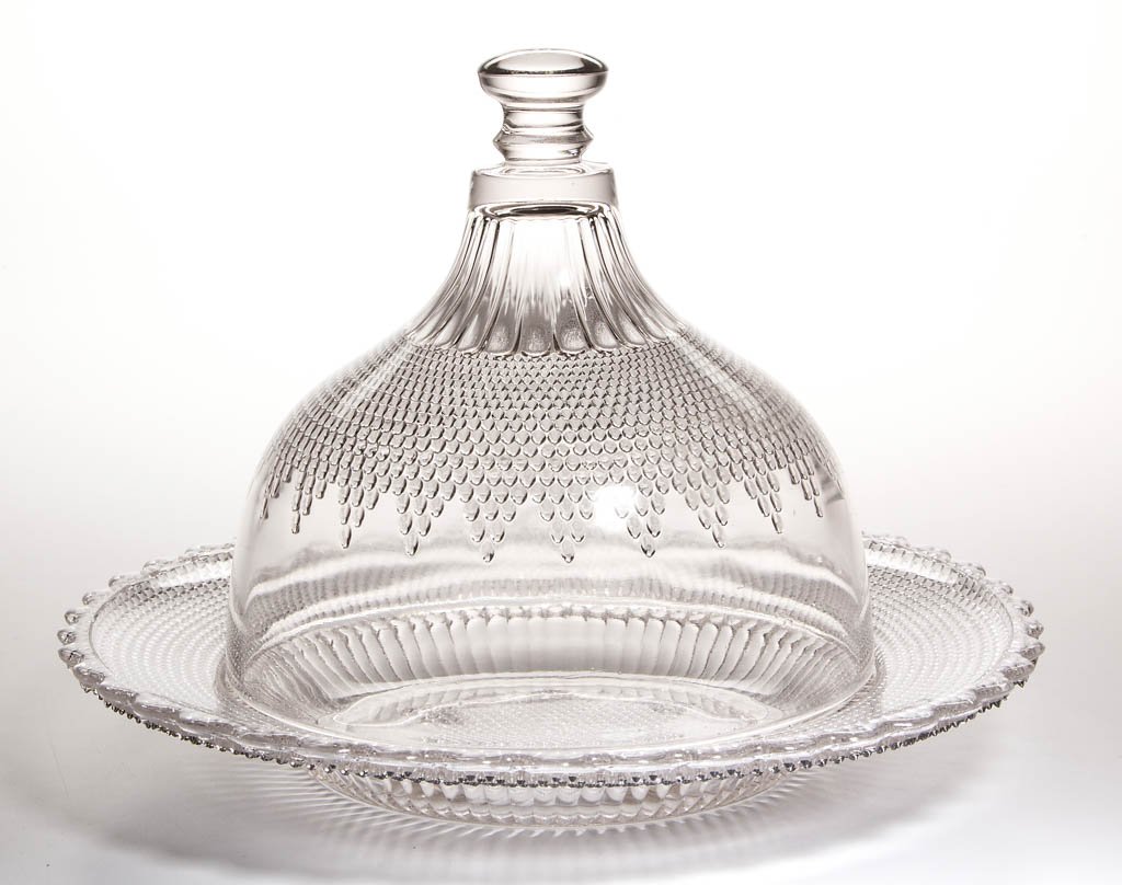 DEWDROP WITH STAR CHEESE DISH: DEWDROP WITH STAR CHEESE DISH, colorless. Campbell, Jones & Co. Circa 1877. 8" HOA, 11" D. Literature: Parallels Reilly/Jenks - Early American Pattern Glass, p. 157, bottom left. Provenance: From the 