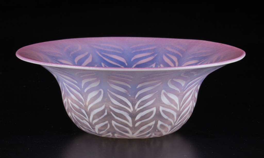 TIFFANY PASTEL FAVRILE OPTIC BOWL: TIFFANY PASTEL FAVRILE OPTIC BOWL, shaded fuchsia with opalescent feather panels, signed "1925 L.C.T. Favrile" around a polished pontil mark. Tiffany Studios. Second quarter 20th century. 2 1/8" H, 6"