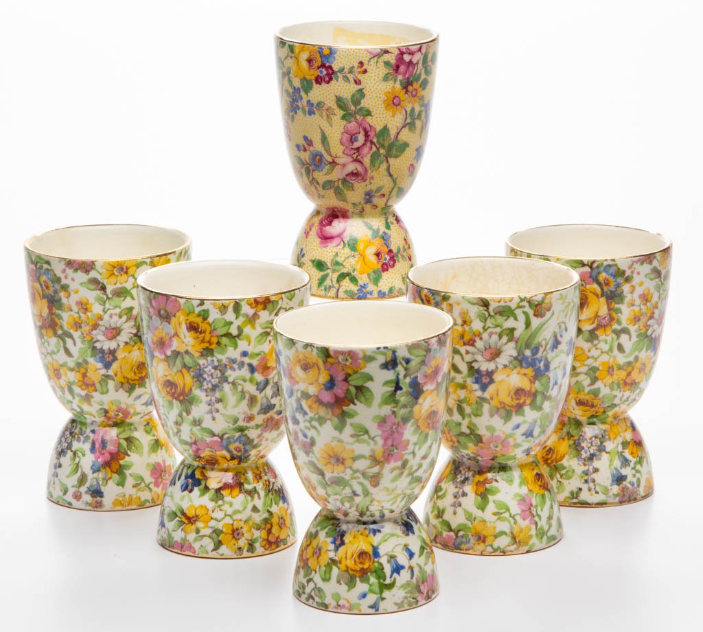 ENGLISH ROYAL WINTON POTTERY CHINTZ EGG CUPS, LOT OF: ENGLISH ROYAL WINTON POTTERY CHINTZ EGG CUPS, LOT OF SIX, comprising five in "Bedale" pattern and one "Clevedon". Various printed marks to underside of each. Circa 1950 and later. 3 7/8" HOA.Provenanc