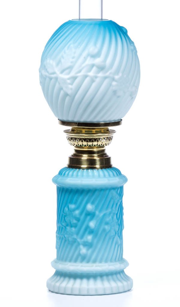 HOLLY EMBOSSED CASED GLASS MINIATURE LAMP: HOLLY EMBOSSED CASED GLASS MINIATURE LAMP, shaded dark to light blue with satin finish, swirling ribs with holly foliage, flowers and berries, matching patterned ball-form shade, period collar. Fitted