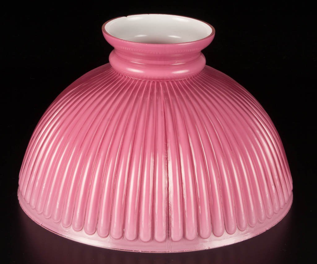 NARROW STRAIGHT RIBBED SHADE: NARROW STRAIGHT RIBBED SHADE, cased pink, umbrella form. Late 19th/early 20th century. 7" H, 12" D fitter.Literature: Parallels Miller/Solverson - Student Lamps of the Victorian Era, p. 90, fig. 98.Pr