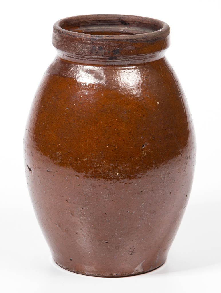 SHENANDOAH VALLEY OF VIRGINIA EARTHENWARE / REDWARE: SHENANDOAH VALLEY OF VIRGINIA EARTHENWARE / REDWARE KITCHEN JAR, lead-glazed, graceful ovoid form with square galleried rim having an inner ledge, clamshell-like cut-off lines and fully glazed under b
