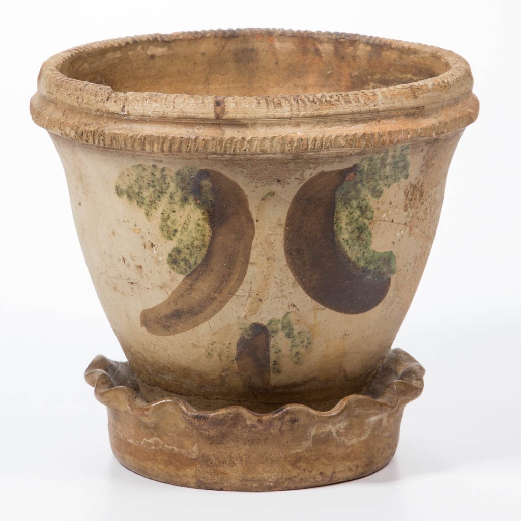 STAMPED "SOLOMON BELL / STRASBURG / VA", SHENANDOAH: STAMPED "SOLOMON BELL / STRASBURG / VA", SHENANDOAH VALLEY OF VIRGINIA DECORATED EARTHENWARE / REDWARE FLOWER POT, slip-washed, conical form with double pie-crust rim, attached ruffled-rim saucer, and