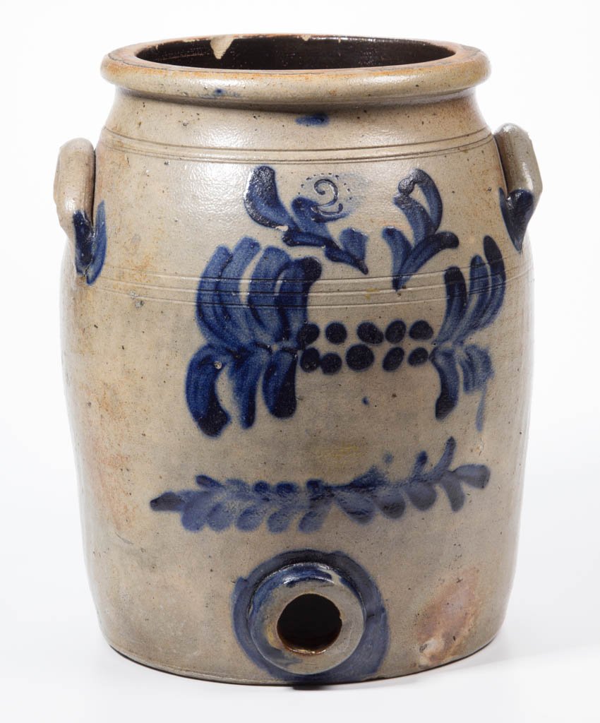 WESTERN PENNSYLVANIA DECORATED STONEWARE DIMINUTIVE: WESTERN PENNSYLVANIA DECORATED STONEWARE DIMINUTIVE COOLER, salt-glazed, crude "2" gallon capacity mark, semi-ovoid form with three incised shoulder rings, beaded neck, rounded rim, arched handles, an