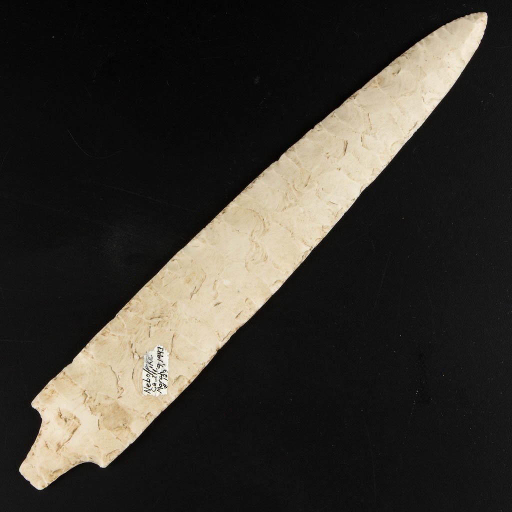 NATIVE AMERICAN STONE POINT: NATIVE AMERICAN STONE POINT, stemmed, large specimen, probably ceremonial. Marked "Nebo/Pike Co. Ill. March 9, 1943" to one face in ink on patch of applied white surface. Attributed by William Jack Hr