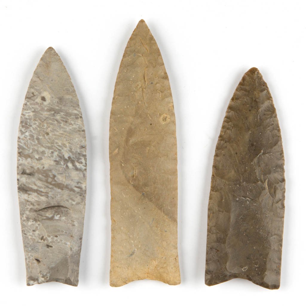 NATIVE AMERICAN STONE POINTS, LOT OF THREE: NATIVE AMERICAN STONE POINTS, LOT OF THREE, each fluted lanceolate, concave base. Attributed by William Jack Hranicky as Clovis points. Attributed to Paleoindian period, 12,000-8,000 B.C. 4 3/8" to 5 