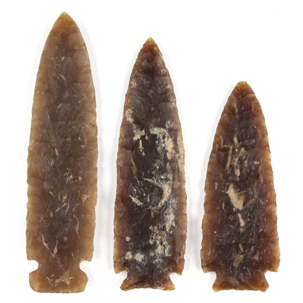 NATIVE AMERICAN STONE POINTS, LOT OF THREE: NATIVE AMERICAN STONE POINTS, LOT OF THREE, each likely of Knife River flint, with notched base. Attributed by William Jack Hranicky. Probably Historic period, 1670 A.D. to present day. 3 5/8" to 4 3/