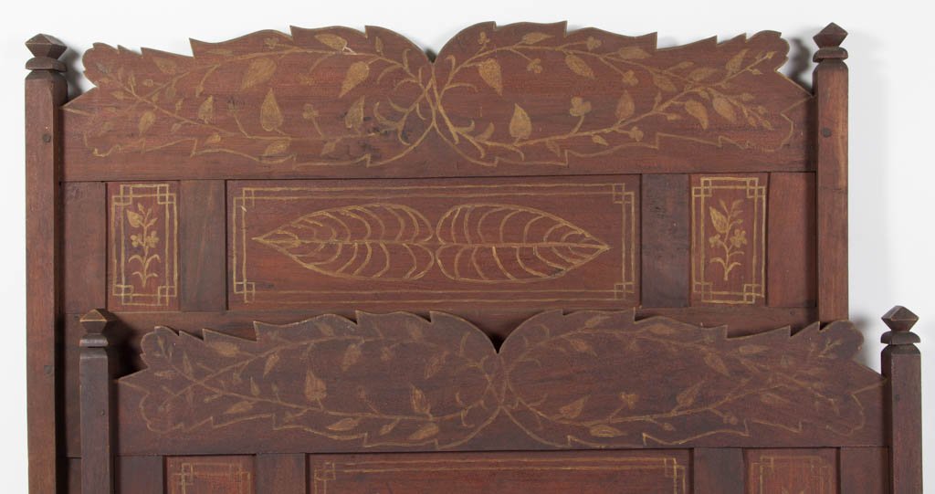 PIEDMONT VIRGINIA FOLK ART CARVED AND PAINTED WALNUT: PIEDMONT VIRGINIA FOLK ART CARVED AND PAINTED WALNUT BED, with carved headboard and footboard featuring original gold-painted decoration of vines, tobacco leaves, and floral devices against a varnishe