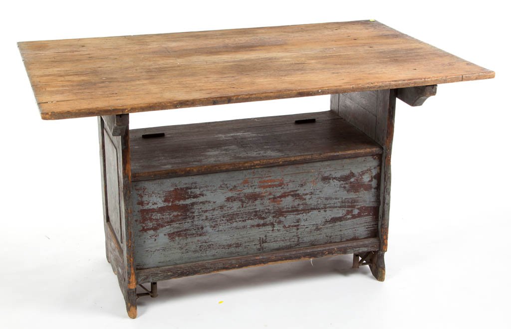 PENNSYLVANIA PAINTED PINE HUTCH / BENCH TABLE: PENNSYLVANIA PAINTED PINE HUTCH / BENCH TABLE, removable three-board scrub top raised on a base with hinged lid concealing a storage well, with raised-panel ends and simple cut-out feet. Old dry gray-
